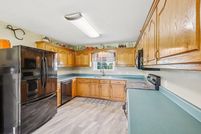4505 Polaris Dr, Chapel Hill, TN 37034 - kitchen featuring black appliances, light countertops, and brown cabinets