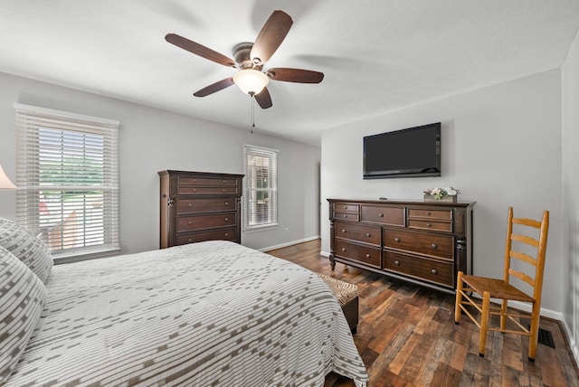 915 Rocky Hollow Rd, Erin, TN 37061 - bedroom with dark wood-type flooring, multiple windows, and a ceiling fan