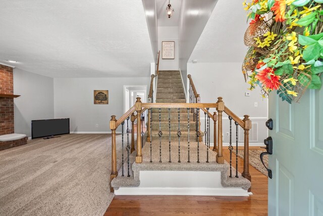 915 Rocky Hollow Rd, Erin, TN 37061 - stairway with wood finished floors and baseboards