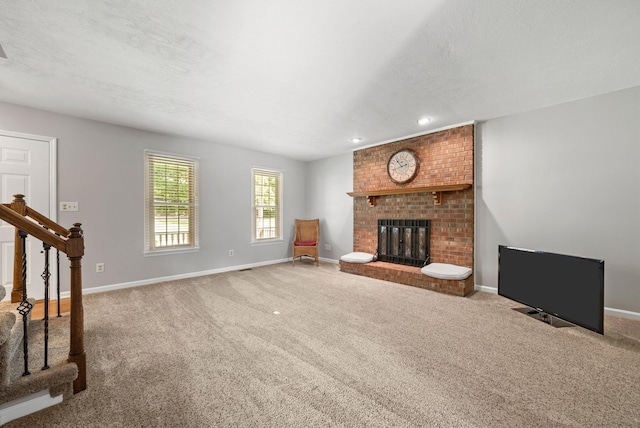 915 Rocky Hollow Rd, Erin, TN 37061 - unfurnished living room featuring stairway, carpet, a fireplace, and recessed lighting
