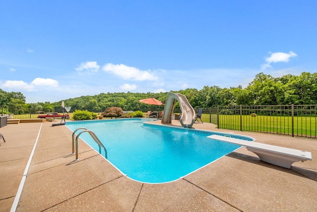 915 Rocky Hollow Rd, Erin, TN 37061 - view of pool featuring a water slide, a diving board, a patio, and view of scattered trees