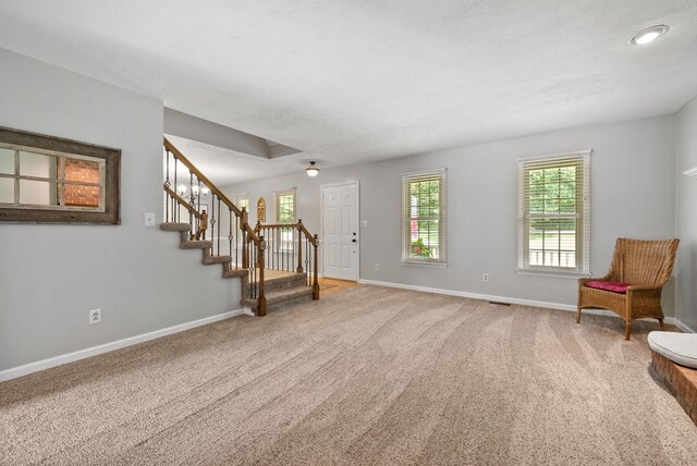 915 Rocky Hollow Rd, Erin, TN 37061 - foyer with carpet, plenty of natural light, and stairway