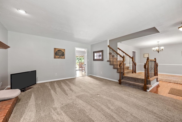 915 Rocky Hollow Rd, Erin, TN 37061 - unfurnished living room featuring stairs, a chandelier, and carpet floors