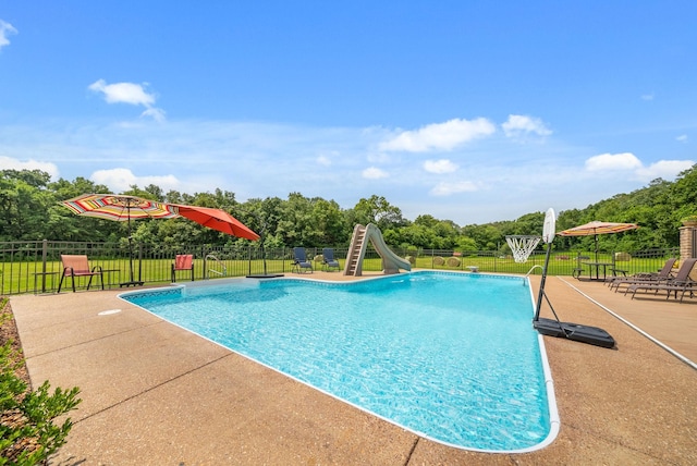 915 Rocky Hollow Rd, Erin, TN 37061 - view of swimming pool with a water slide, a patio, and view of scattered trees