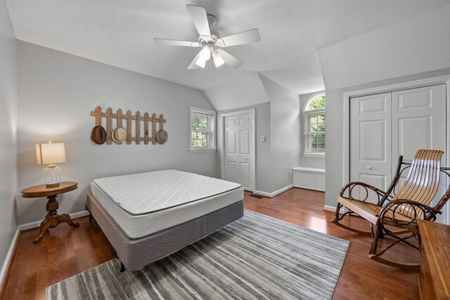915 Rocky Hollow Rd, Erin, TN 37061 - bedroom featuring vaulted ceiling, multiple windows, wood finished floors, and ceiling fan