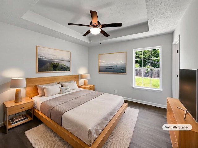 147 Greystone Dr, Springfield, TN 37172 - bedroom with a raised ceiling, dark wood-type flooring, and ceiling fan