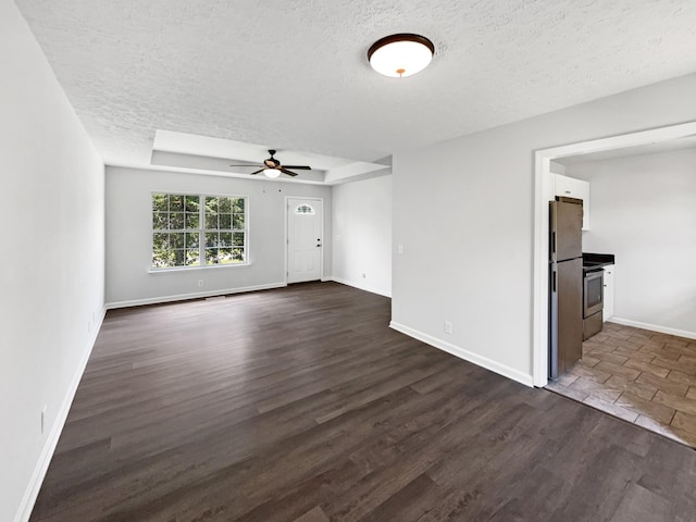 147 Greystone Dr, Springfield, TN 37172 - unfurnished room with a textured ceiling, a ceiling fan, and dark wood-style flooring