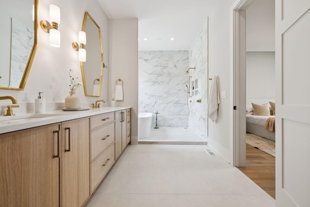 6315 Callie Ln, Brentwood, TN 37027 - ensuite bathroom featuring double vanity, a freestanding tub, a marble finish shower, recessed lighting, and tile patterned flooring