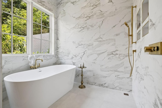 6315 Callie Ln, Brentwood, TN 37027 - bathroom featuring a soaking tub, a marble finish shower, and tile walls