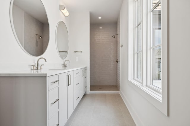 6315 Callie Ln, Brentwood, TN 37027 - full bathroom with double vanity, healthy amount of natural light, a tile shower, and tile patterned flooring