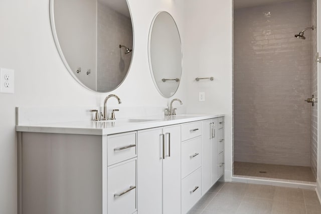 6315 Callie Ln, Brentwood, TN 37027 - bathroom featuring double vanity, tiled shower, and tile patterned flooring