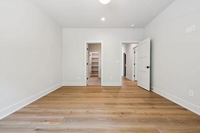 6315 Callie Ln, Brentwood, TN 37027 - unfurnished bedroom with a walk in closet, light wood-type flooring, and recessed lighting