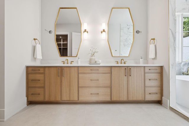 6315 Callie Ln, Brentwood, TN 37027 - full bath featuring double vanity, a freestanding bath, and tile patterned flooring