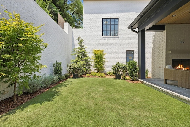 6315 Callie Ln, Brentwood, TN 37027 - view of grassy yard with a lit fireplace