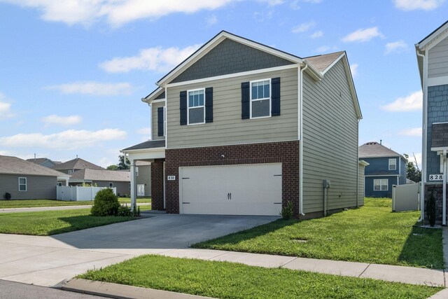 830 Long Leaf Rd, Lebanon, TN 37087 - view of front of house featuring a front lawn, a garage, concrete driveway, and brick siding