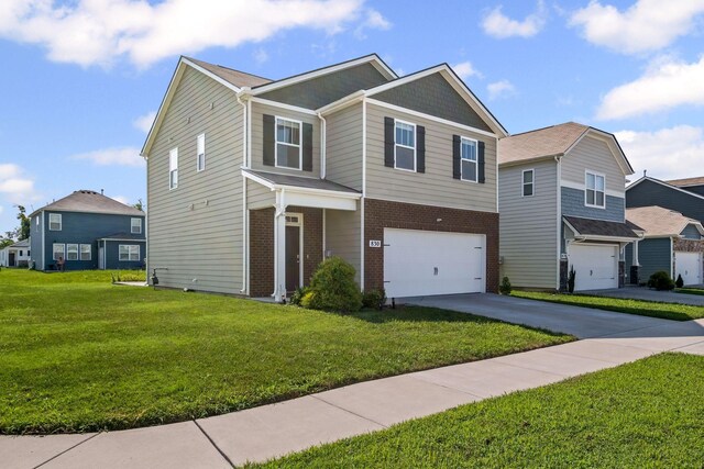 830 Long Leaf Rd, Lebanon, TN 37087 - view of front of home with an attached garage, brick siding, a front yard, and driveway