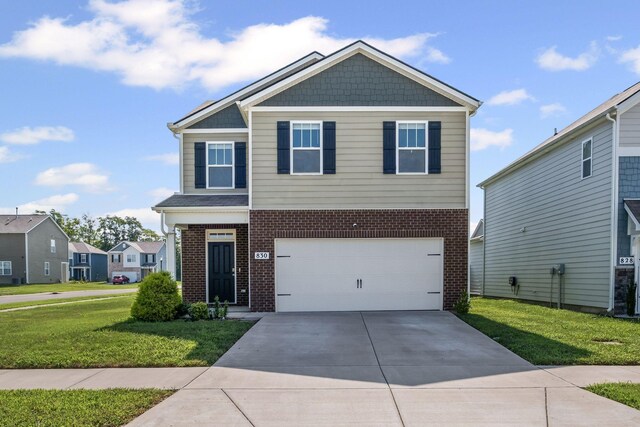 830 Long Leaf Rd, Lebanon, TN 37087 - craftsman-style home featuring brick siding, a front lawn, driveway, and an attached garage