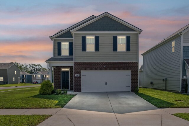 830 Long Leaf Rd, Lebanon, TN 37087 - view of front of property featuring brick siding, a front yard, concrete driveway, and a garage