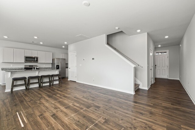 830 Long Leaf Rd, Lebanon, TN 37087 - unfurnished living room with recessed lighting, dark wood finished floors, and stairs