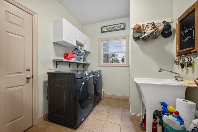 116 Sherrolyn Ct, Burns, TN 37029 - washroom featuring separate washer and dryer, cabinet space, and light tile patterned floors