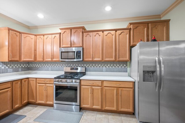 116 Sherrolyn Ct, Burns, TN 37029 - kitchen featuring appliances with stainless steel finishes, ornamental molding, light countertops, and decorative backsplash