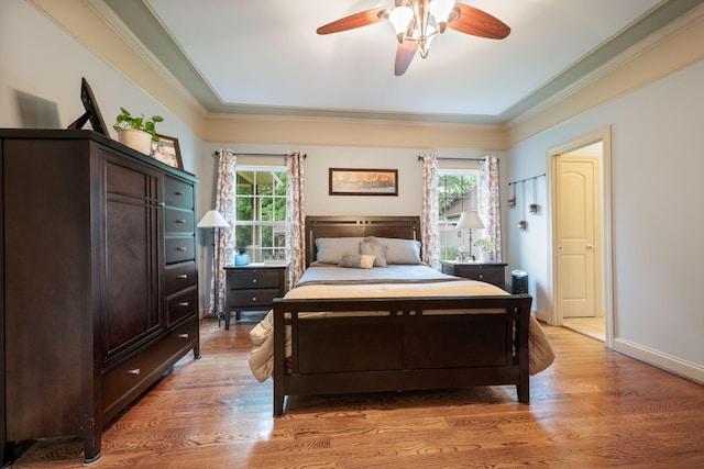 116 Sherrolyn Ct, Burns, TN 37029 - bedroom with multiple windows, ornamental molding, light wood-type flooring, and a ceiling fan