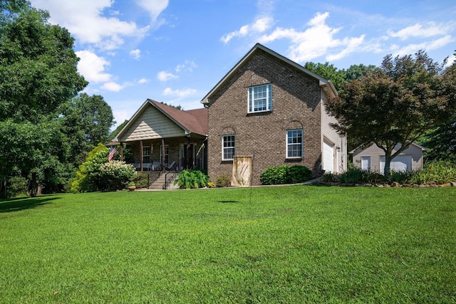 116 Sherrolyn Ct, Burns, TN 37029 - view of front of home with a porch, brick siding, a front yard, and a garage