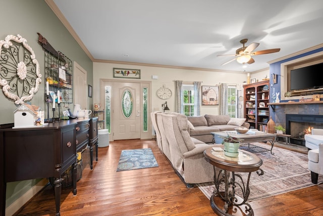 116 Sherrolyn Ct, Burns, TN 37029 - living room featuring ornamental molding, a tiled fireplace, wood finished floors, and a ceiling fan