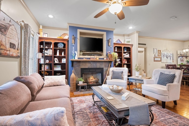 116 Sherrolyn Ct, Burns, TN 37029 - living area with crown molding, ceiling fan, wood finished floors, a fireplace, and recessed lighting