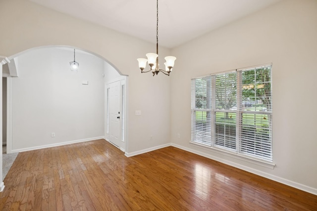 3455 Esquire Dr, Murfreesboro, TN 37130 - unfurnished room with arched walkways, wood finished floors, and a chandelier