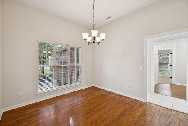 3455 Esquire Dr, Murfreesboro, TN 37130 - unfurnished room featuring wood finished floors and a chandelier