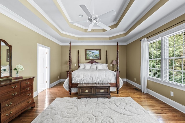 9732 Turnbridge Ct, Brentwood, TN 37027 - bedroom featuring a raised ceiling, ornamental molding, wood finished floors, and ceiling fan