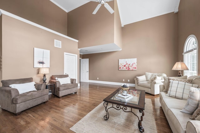 9732 Turnbridge Ct, Brentwood, TN 37027 - living room featuring crown molding, a towering ceiling, ceiling fan, and wood finished floors