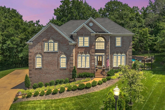9732 Turnbridge Ct, Brentwood, TN 37027 - colonial house with a front yard and brick siding