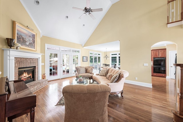 9732 Turnbridge Ct, Brentwood, TN 37027 - living area featuring a ceiling fan, a fireplace, high vaulted ceiling, wood finished floors, and ornamental molding