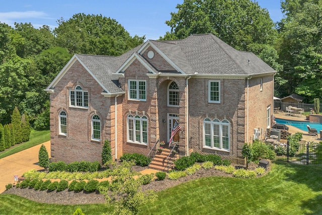 9732 Turnbridge Ct, Brentwood, TN 37027 - colonial home featuring brick siding, a shingled roof, and a patio