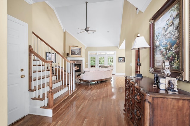 9732 Turnbridge Ct, Brentwood, TN 37027 - foyer entrance with ornamental molding, wood finished floors, a ceiling fan, a glass covered fireplace, and high vaulted ceiling