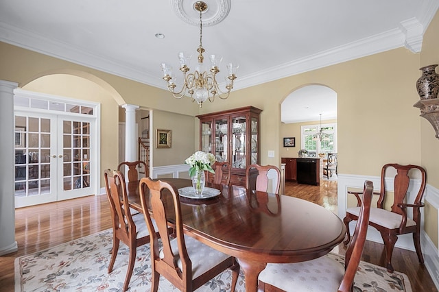 9732 Turnbridge Ct, Brentwood, TN 37027 - dining space with wood finished floors, french doors, ornamental molding, a chandelier, and ornate columns