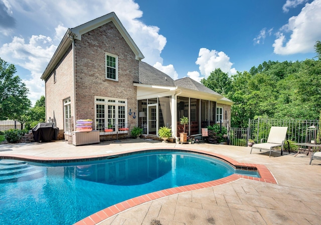 9732 Turnbridge Ct, Brentwood, TN 37027 - view of swimming pool featuring a sunroom, a patio, a grill, and french doors