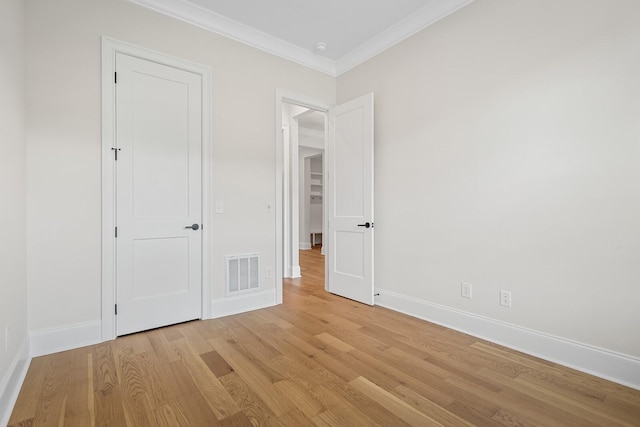 7428 Leelee Dr, Franklin, TN 37064 - unfurnished bedroom featuring light wood-style floors and ornamental molding