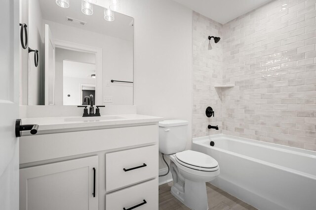 7428 Leelee Dr, Franklin, TN 37064 - bathroom featuring vanity, wood finished floors, and washtub / shower combination