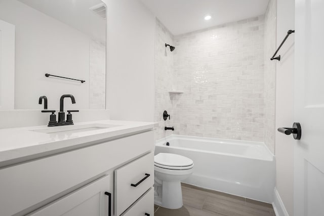 7428 Leelee Dr, Franklin, TN 37064 - full bathroom with vanity, shower / bath combination, recessed lighting, and wood finished floors