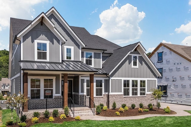 7428 Leelee Dr, Franklin, TN 37064 - view of front of property with a shingled roof, board and batten siding, a standing seam roof, and covered porch