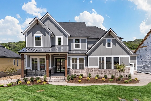 7428 Leelee Dr, Franklin, TN 37064 - view of front facade featuring a porch, a standing seam roof, and board and batten siding