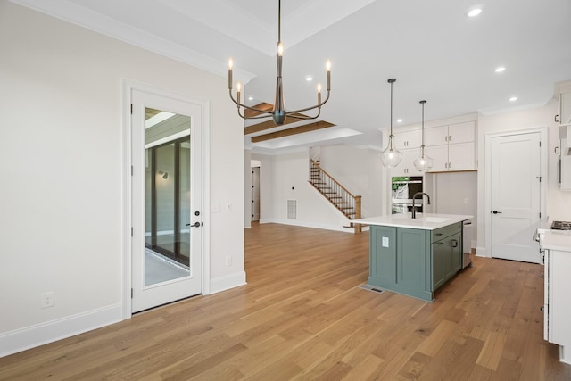 7428 Leelee Dr, Franklin, TN 37064 - kitchen with a chandelier, light countertops, recessed lighting, light wood finished floors, and a kitchen island with sink