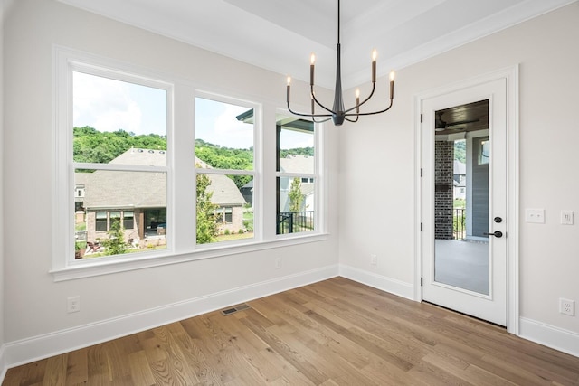 7428 Leelee Dr, Franklin, TN 37064 - unfurnished dining area featuring a chandelier and light wood-type flooring