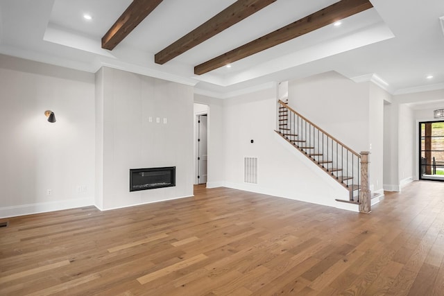 7428 Leelee Dr, Franklin, TN 37064 - unfurnished living room featuring stairs, light wood-style floors, beamed ceiling, recessed lighting, and a fireplace