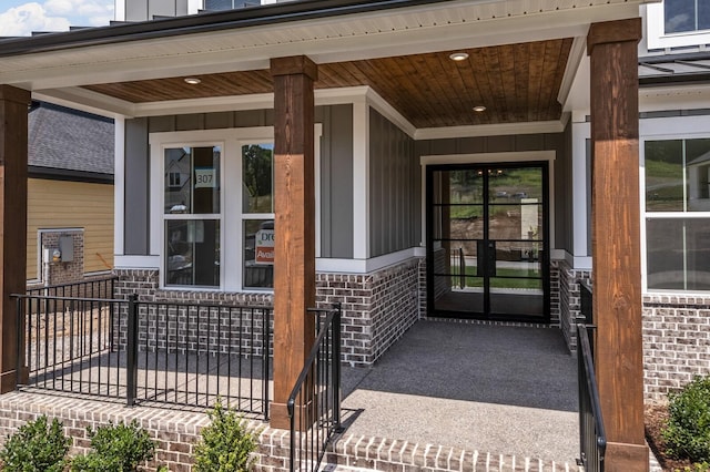 7428 Leelee Dr, Franklin, TN 37064 - entrance to property featuring a porch, brick siding, and board and batten siding