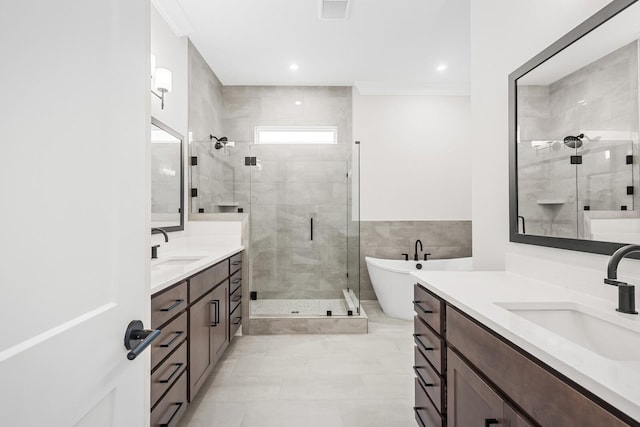 7428 Leelee Dr, Franklin, TN 37064 - full bath with a stall shower, two vanities, a freestanding bath, tile patterned floors, and crown molding