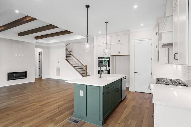 7428 Leelee Dr, Franklin, TN 37064 - kitchen featuring stainless steel appliances, white cabinets, green cabinets, wood finished floors, and open shelves